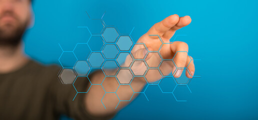 Abstract image of a person touching a glowing hexagon grid, representing technology, innovation,...