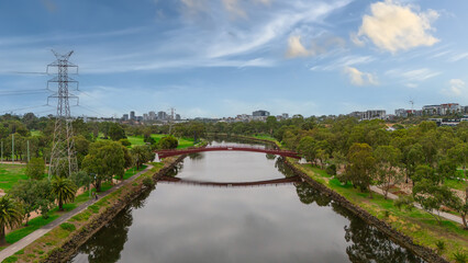Fototapeta premium Panoramic Aerial Drone view of Inner Suburbs of Melbourne housing, roof tops, the streets and the parks, the roads and trees of Ascot Vale Moonee Ponds Brunswick Essendon and Maribyrnong in VIC Victor