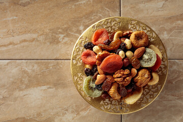 Assortment of dried tropical fruits, nuts and raisins.