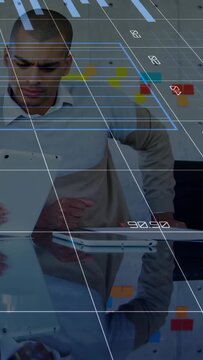 Vertical video: Man tapping pad, causing blue donut chart, white grid and HUD showing business data