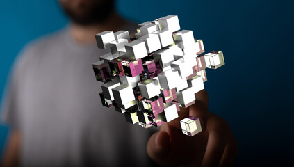Close-up of a person interacting with an abstract digital cube formation, symbolizing innovation...