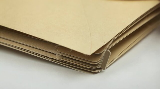 Closeup of a manila paper folder, clean composition ample negative space