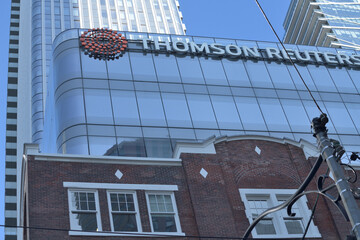 Naklejka premium sign on the exterior of Thomson Reuters, a mixed use business and condo tower at 19 Duncan St, Toronto