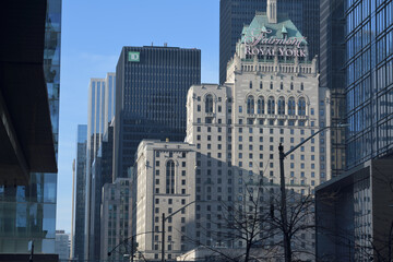 Naklejka premium looking north on York St to Fairmont Royal York hotel and modern office towers (TD Centre) from about Lake Shore Blvd W, Toronto