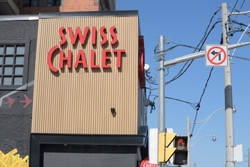 Naklejka premium exterior building and sign outside Swiss Chalet Express, a restaurant, located at 722 Pape Av, Toronto