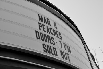 Naklejka premium black and white view of a marquee sign outside Danforth Music Hall for sold out event held March 4 2026, 147 Danforth Av, Toronto