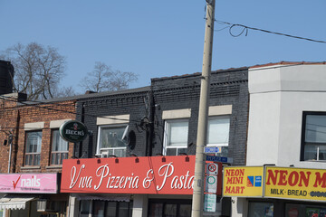 Naklejka premium exterior of shops on O'Connor Dr including Viva Pizzeria & Pasta House, a restaurant, located at 158 O'Connor Dr, Toronto