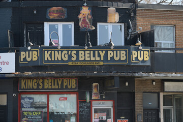 Naklejka premium exterior building facade and sign of King's Belly Pub located at 429a Donlands Av, East York, Toronto