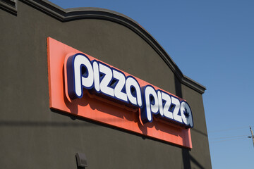 Naklejka premium exterior building facade and sign of Pizza Pizza, a pizza restaurant, located at 796 O'Connor Dr, East York, Toronto