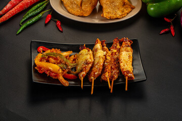 Grilled Chicken Skewers with Melted Cheese and Sautéed Vegetables