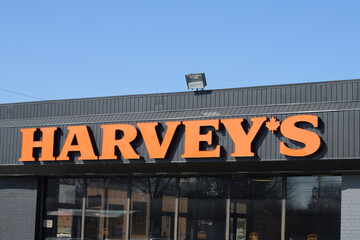 Naklejka premium sign on the exterior of Harvey's Canada restaurant located here at 1100 O'Connor Dr, Toronto