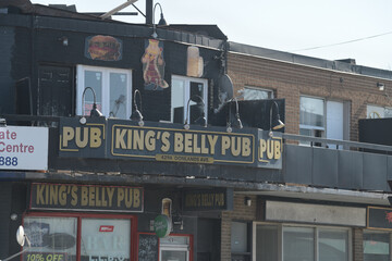 Naklejka premium exterior building facade and sign of King's Belly Pub located at 429a Donlands Av, East York, Toronto