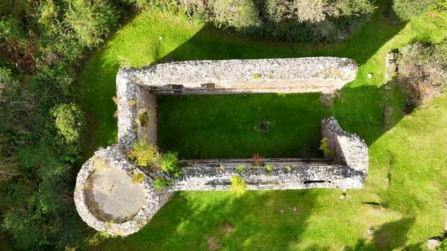 Aerial Cinematic View of Ruined Medieval Rait Castle in Nairn Scotland, Scenic Highland Landscape 