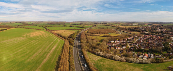 Aerial drone picture showcasing the market town of Whitchurch in Hampshire, England. Elevated panoramic views reveal residential neighborhoods © Radd