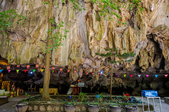 Decorated cave shrine with stalactites and small trees