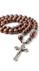 A close-up shot of a rosary with a crucifix