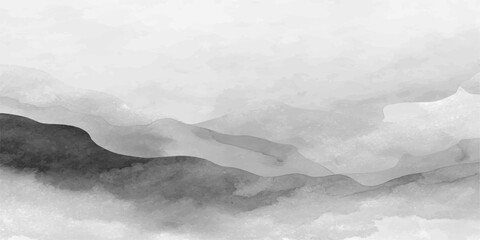 A majestic misty mountain landscape unfolds under a dark storm sky where white clouds and thick fog drift over snow-capped peaks at sunset, creating a dramatic winter nature view for travel © ITS OK