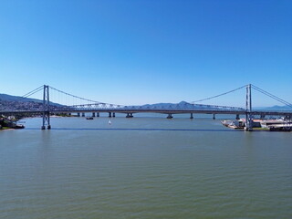 Obraz premium Hercílio Luz Bridge. Colombo Salles Bridge. Pedro Ivo Campos Bridge. Florianópolis, Santa Catarina, Brazil. Bridges, sea, ocean. 