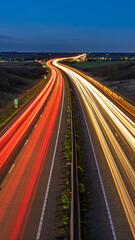 Night highway long exposure with red and white light trails © di-photo