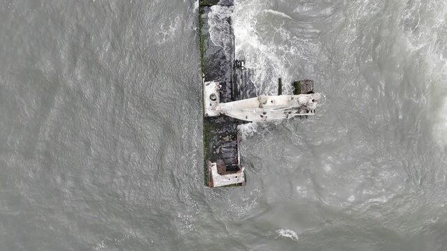 Drone flies in bird's eye view over Zeila Shipwreck on the Skeleton Coast in the desert in Namibia