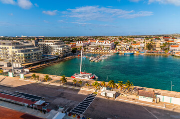 Fototapeta premium A view from the cruise port across the north side of the marina in Oranjestad, Aruba on a bright morning