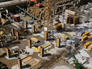 Construction of the foundation of the underground floor of a multi-story building, view of the construction site from above