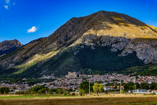 Celano town and Castello Piccolomini beneath the Sirente-Velino mountains, Abruzzo, Italy