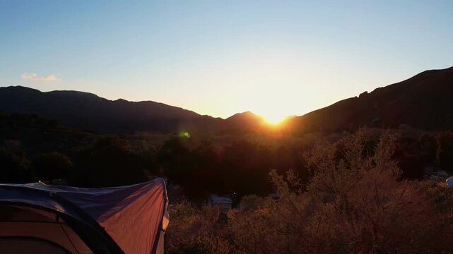 tent camping in the moutains at sunset slo motion footage no people
