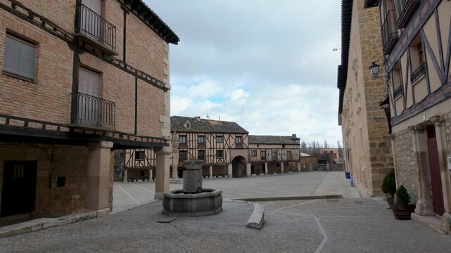 Pe&ntilde;aranda de duero main square with traditional castilian architecture and cobblestone pavement