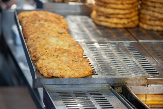 Traditional Korean mung bean pancake bindaetteok frying at market stall