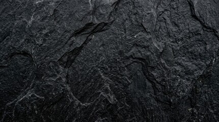 Dark textured slate stone background with natural patterns