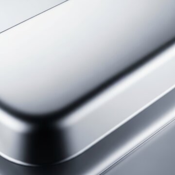 Extreme macro view of a silver ingot surface, showcasing a brilliant metallic shine gradient and smooth, reflective texture, polished, silver, shine