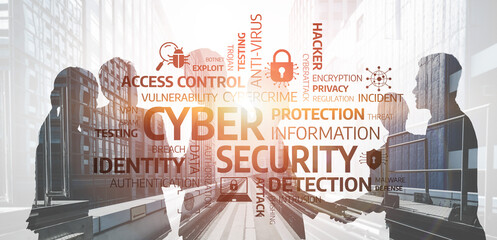 Two professionals engage in a discussion about cybersecurity concepts in a modern office,...