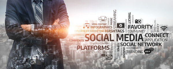 A confident businessman stands in front of a city skyline, symbolizing the connection between professional success and effective social media engagement strategies. Tessel © InfiniteFlow