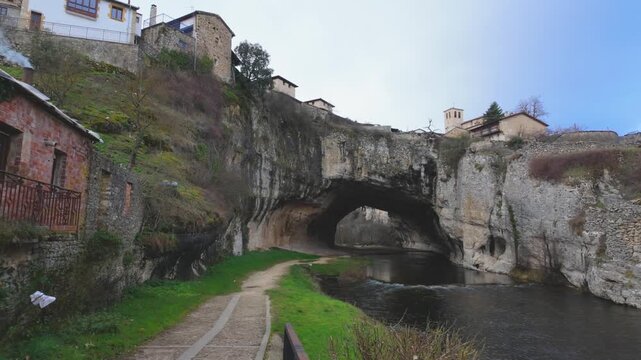 Puentedey village built on a natural limestone arch formed by the nela river