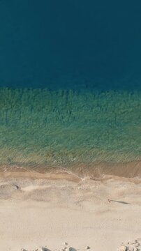 Sea and Empty Beach of Roccella Ionica city in Calabria Italy aerial overhead