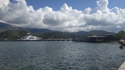 Harbor view with yacht in the distance