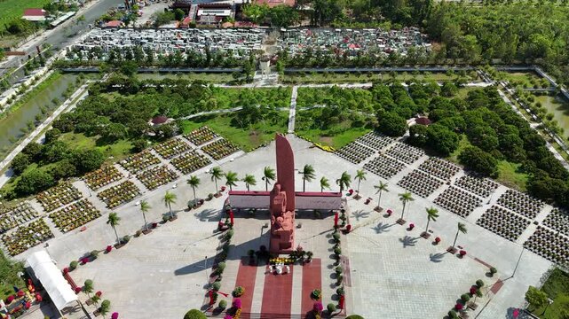 Martyrs Cemetery of Vinh Long Province, Tan Ngai, Vietnam &ndash; 4K aerial drone footage of national memorial monument and military cemetery, tropical landscape in the Mekong Delta, near Jade Buddha Pagoda