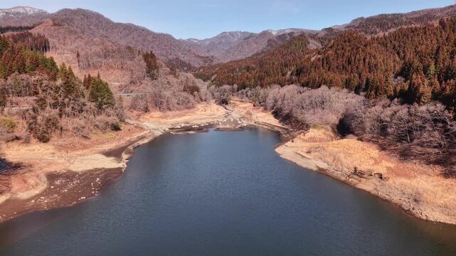 Aerial view of Kirizumi Dam in early spring, Gunma Japan mountain landscape