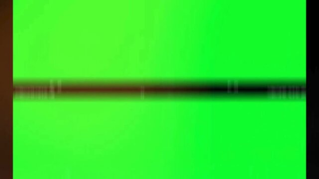 Old cinematic film frame transition with heavy grain and organic light leaks over a professional chroma key green screen background for retro projects