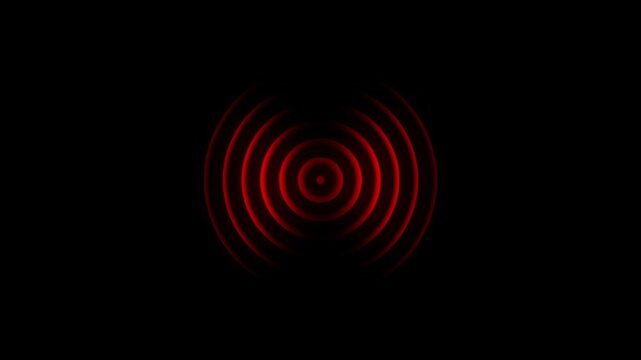 Concentric red glowing circles emanating outwards from a central point against a deep black background representing sound waves or a signal pulse
