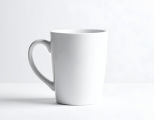 Obraz premium Plain white ceramic mug with handle on a white surface