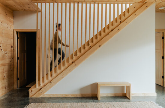 A blurred image of a woman walking up stairs.