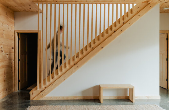A blurred image of a woman walking up stairs.