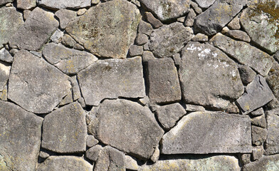 Fototapeta premium Natural weathered stone texture background with moss