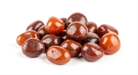 Obraz premium Smooth tumbled carnelian stones elegantly arranged on a pristine white background, showcasing their rich orange and red hues with a polished, glossy finish, isolated