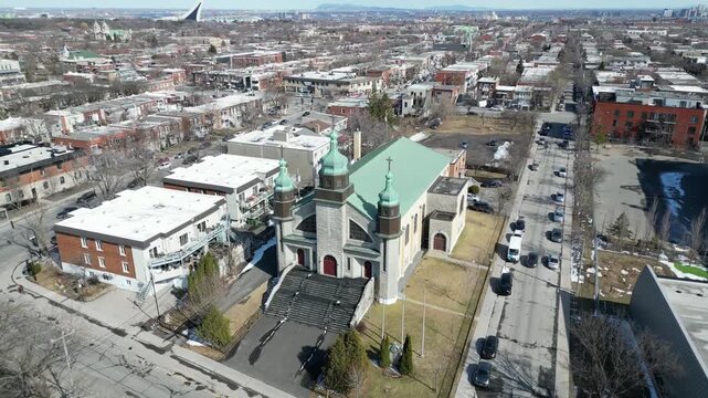 Aerial view of Assumption of the Blessed Virgin Mary Catholic Church in Montreal on a clear winter day. g