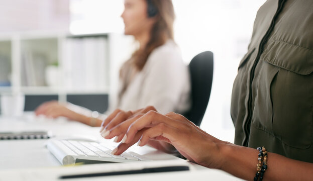 Woman, hands and typing with keyboard in call center for data entry, enquiry or customer service. Female person, agent or consultant taking notes on keypad for company feedback or follow up in agency