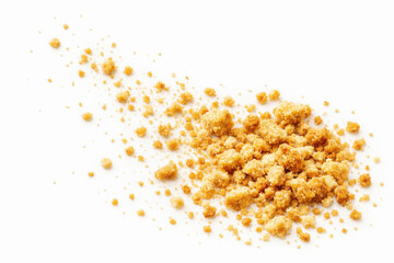 Golden Brown Sugar Crumbs Isolated on White Background
