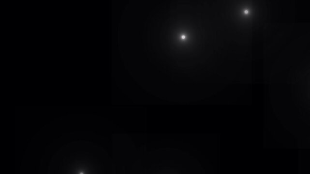 Flashing lens flare camera flashes of photographers animation on black background. Many of flash lights with random switch. Flashing lens flares seamless looping. Lots of photo camera flashing.
